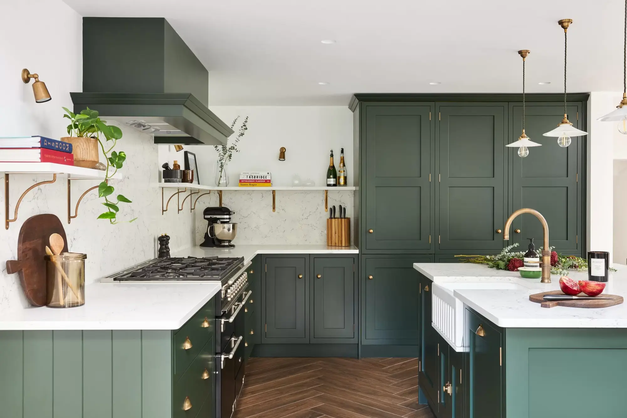 Green shaker kitchen with a range cooker, Belfast sink and open wall shelves